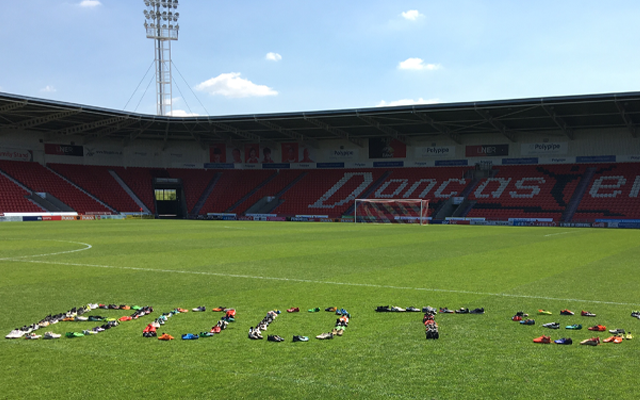 Club Doncaster begin handover of donated boots to DCC United