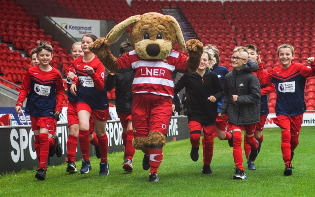 Doncaster children complete laps of Keepmoat Stadium pitch for ‘Mile for Mind’ during Mental Health Awareness Week 